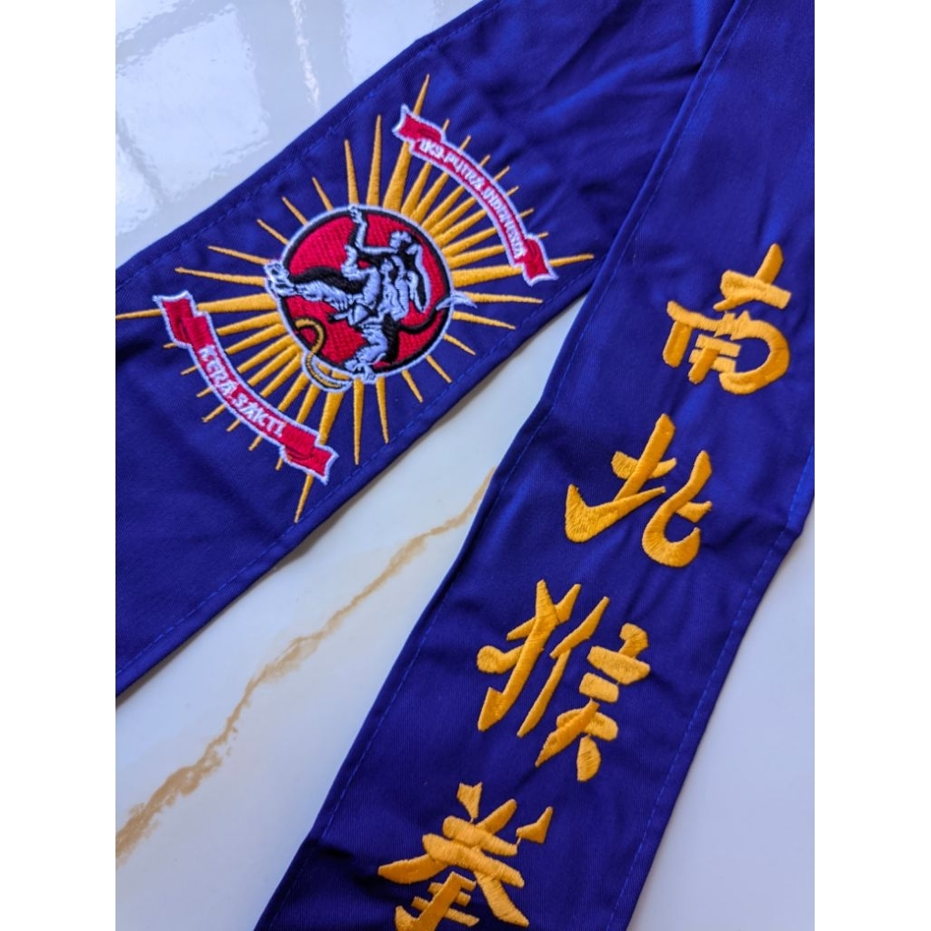 sabuk ikspi biru drel sabuk beladiri ikspi bahan drel motif lambang