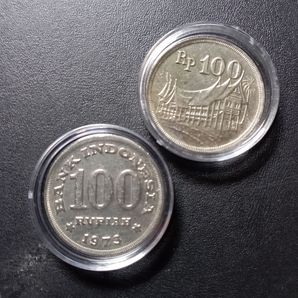 100 rupiah uang koin rumah gadang bekas dibersihkan asli