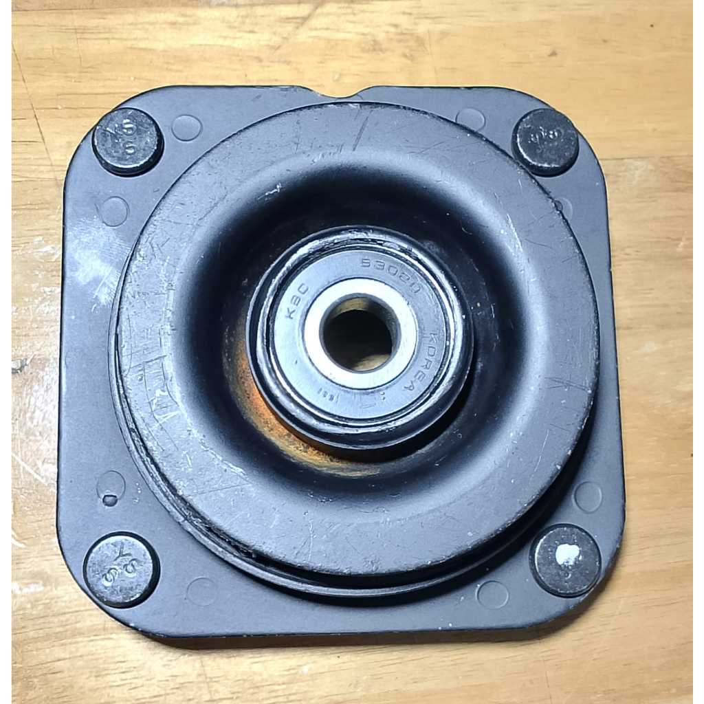 support shock kia caren  -depan K2FA-34-380