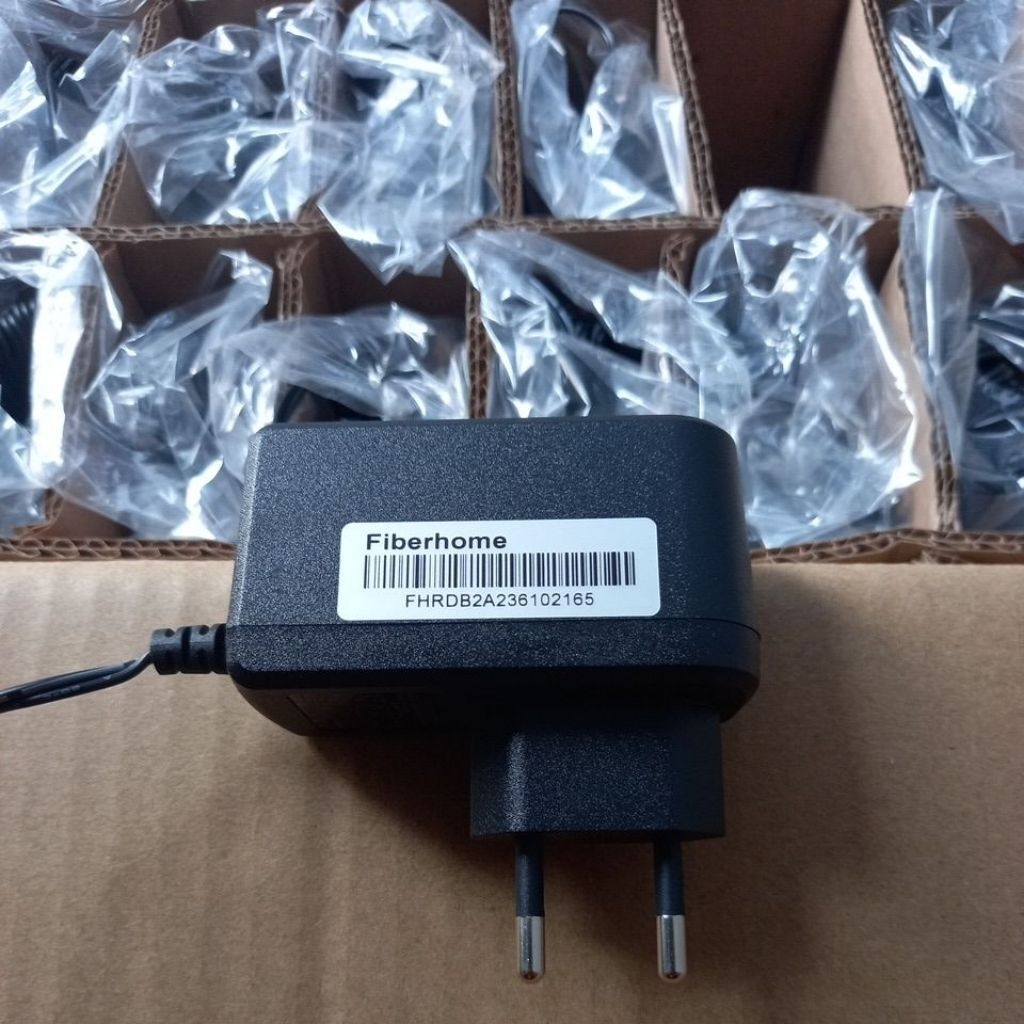 adaptor bawaan modem fiberhome 12volt 1,5ampere