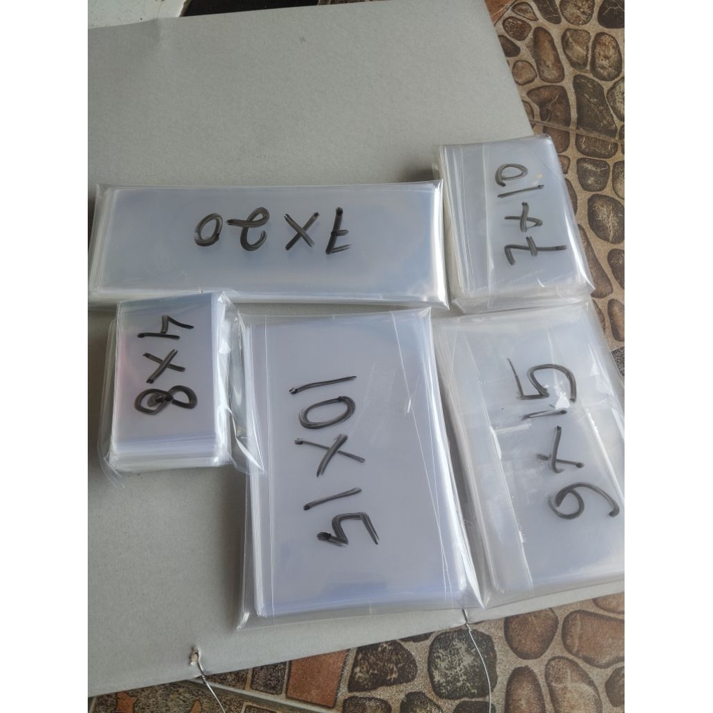 semua ukuran 100 gram plastik opp bening/kaca  untuk kemasan mainan dan accessories tanpa lem