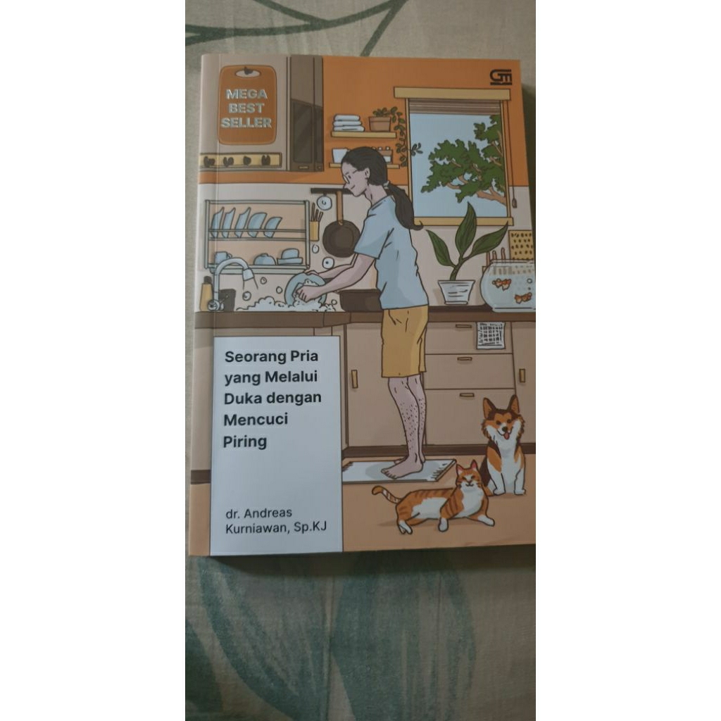 seorang pria yang melalui duka dengan mencuci piring