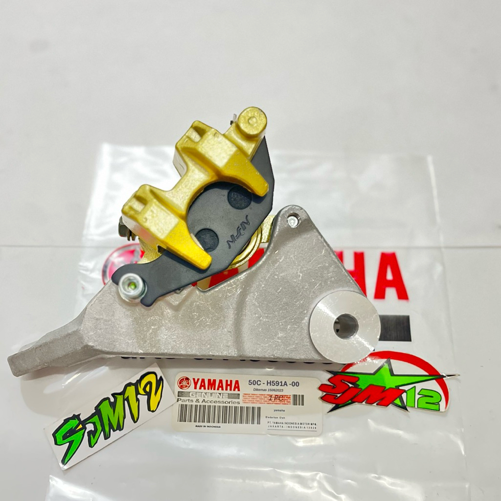 KALIPER CAKRAM +BREKET BELAKANG JUPITER MX 135 NEW(ORI NISIN)