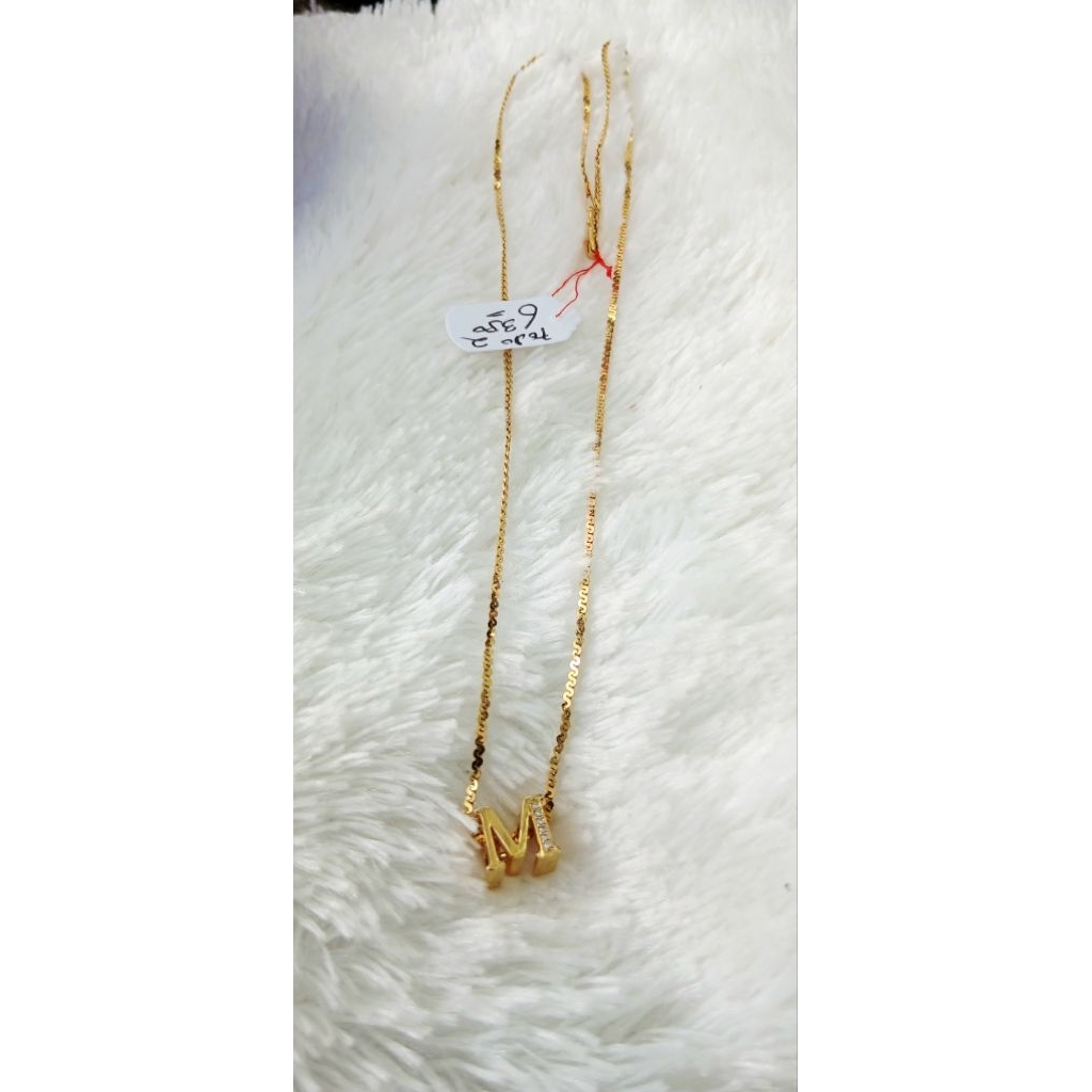 kalung huruf M mt banyak emas kadar 16k berat 6,35gr