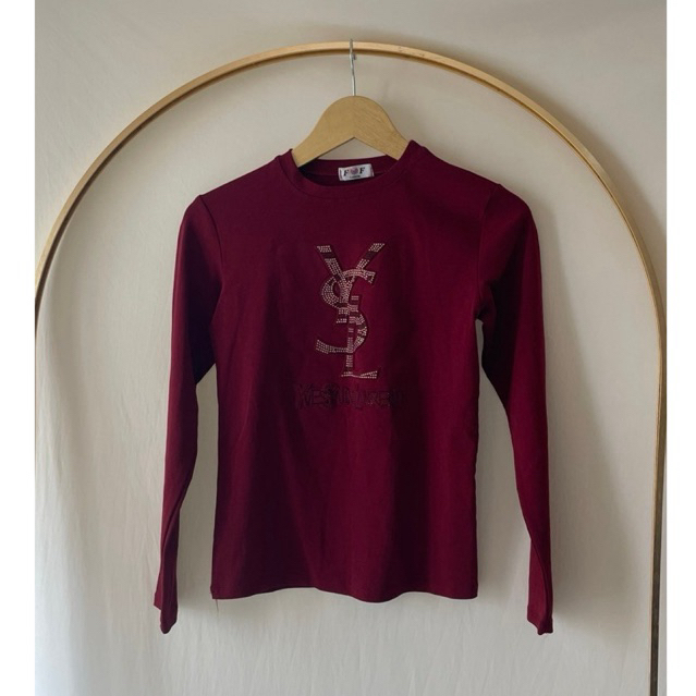 Preloved  kaos lengan panjang wanita merah marun dengan logo YSL YVES SAINT LAURENT