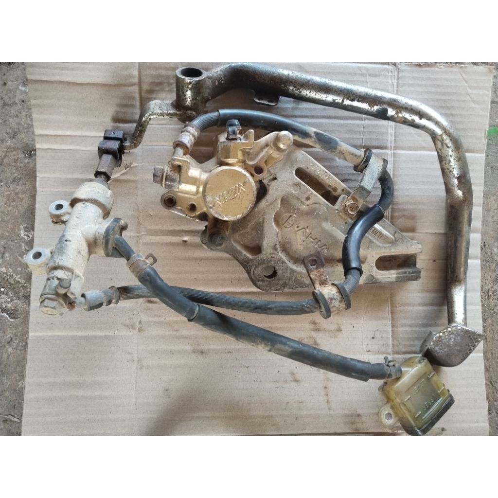 PENGEREMAN BELAKANG CAKRAM+PEDAL REM SUPRA X 125 TR DOBLE DISC NORMAL ORIGINAL COPOTAN MOTOR