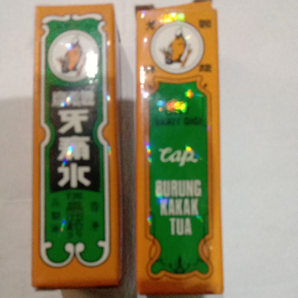 Cap burung kakatua obat sakit gigi