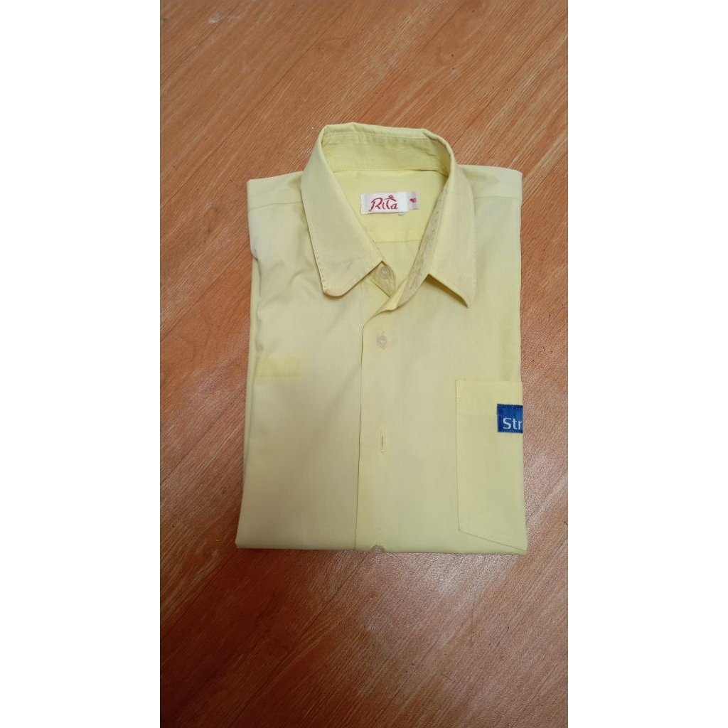 Seragam sekolah SMP Strada kuning preloved