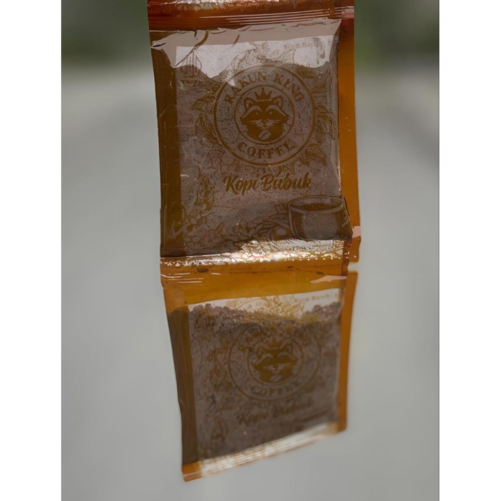 

Kopi Bubuk Rakun King hitam. minimal order 10 sachet. Berat +-23 gram