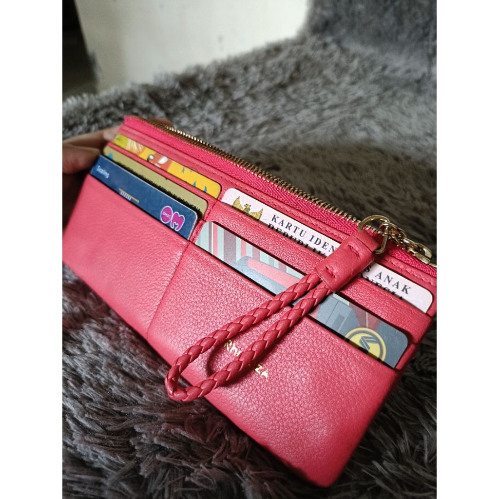 dompet panjang kulas rhizliza warna pink neon