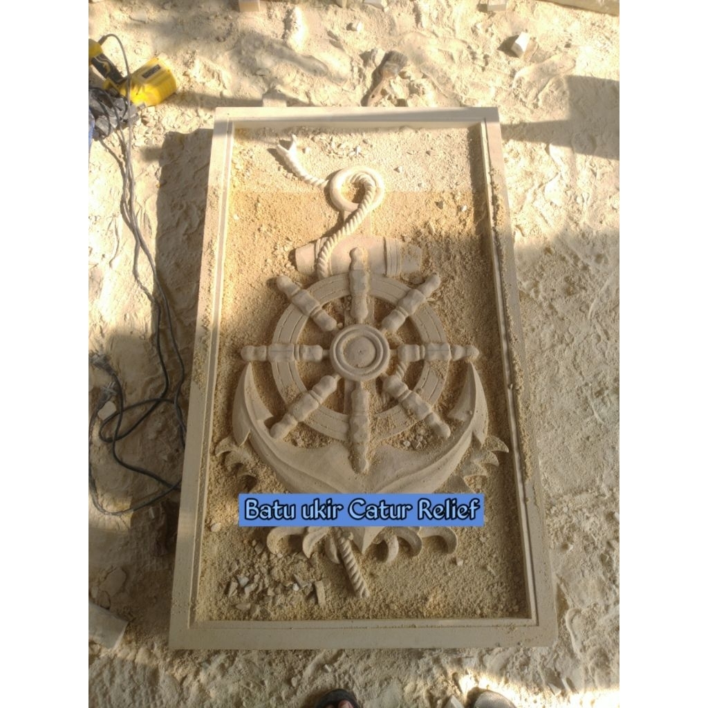 Batu alam ukir paras jogja motif jangkar hiasan dinding rumah