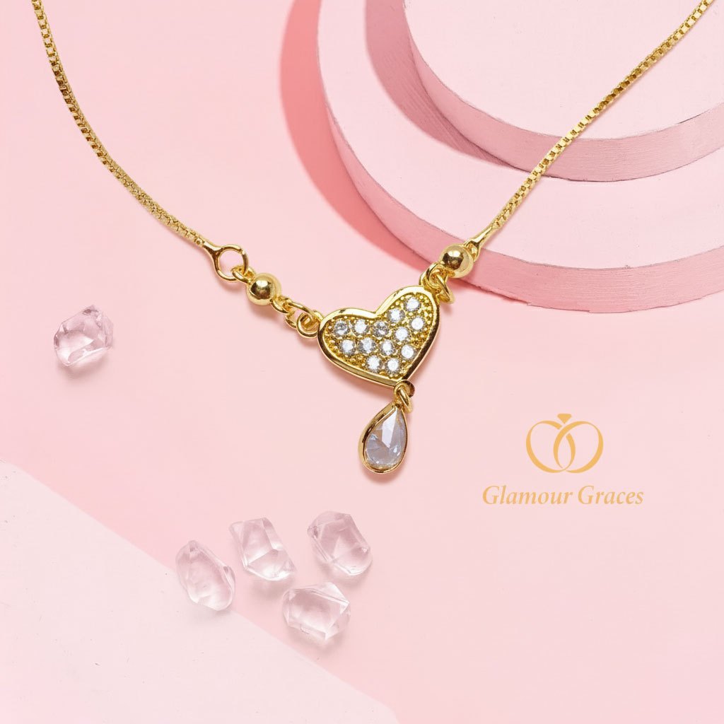 Glamour Graces Kalung Titanium Lapis Emas Motif Love Koye Motif Love Permata Bandul Oval Mini