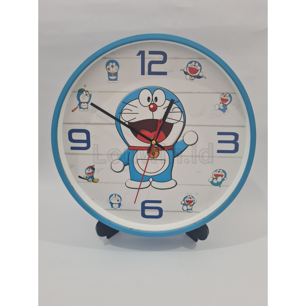jam dinding ogana / jam dinding anak / jam dinding doraemon / jam dinding biru / jam dinding makassa