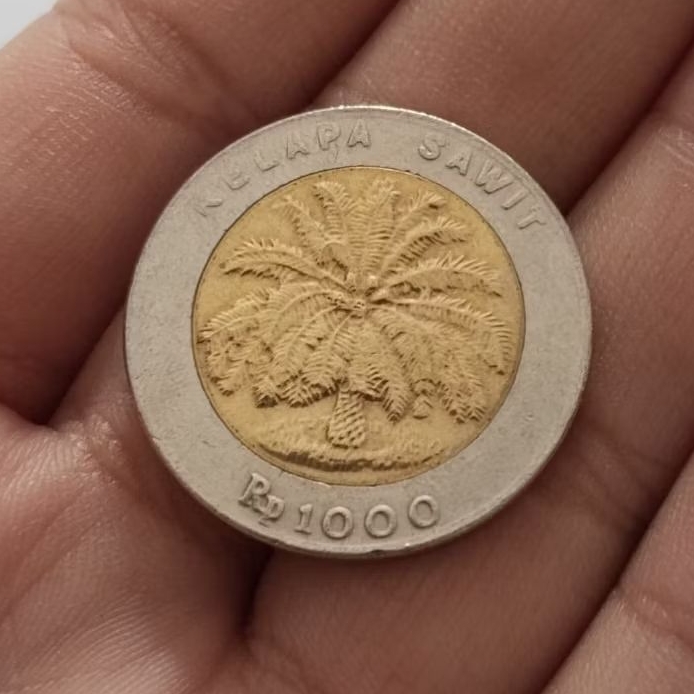 uang koin antik 1000 kelapa sawit