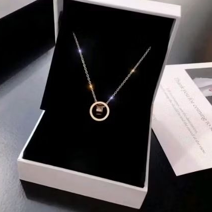 kalung wanita titanium.liontin ring double