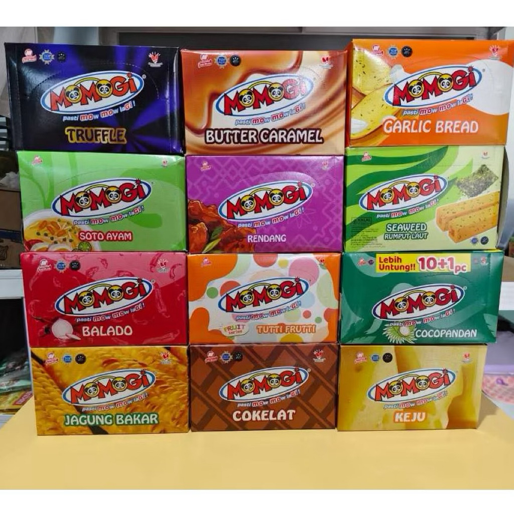 Momogi Stick All Variant per box isi 10*12 g rasa jagung, jagung bakar pedas,Sate ayam, rumput laut,