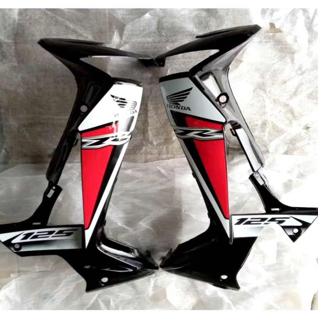 sayap depan Supra x 125 new sticker dek Supra 125 merah hitam