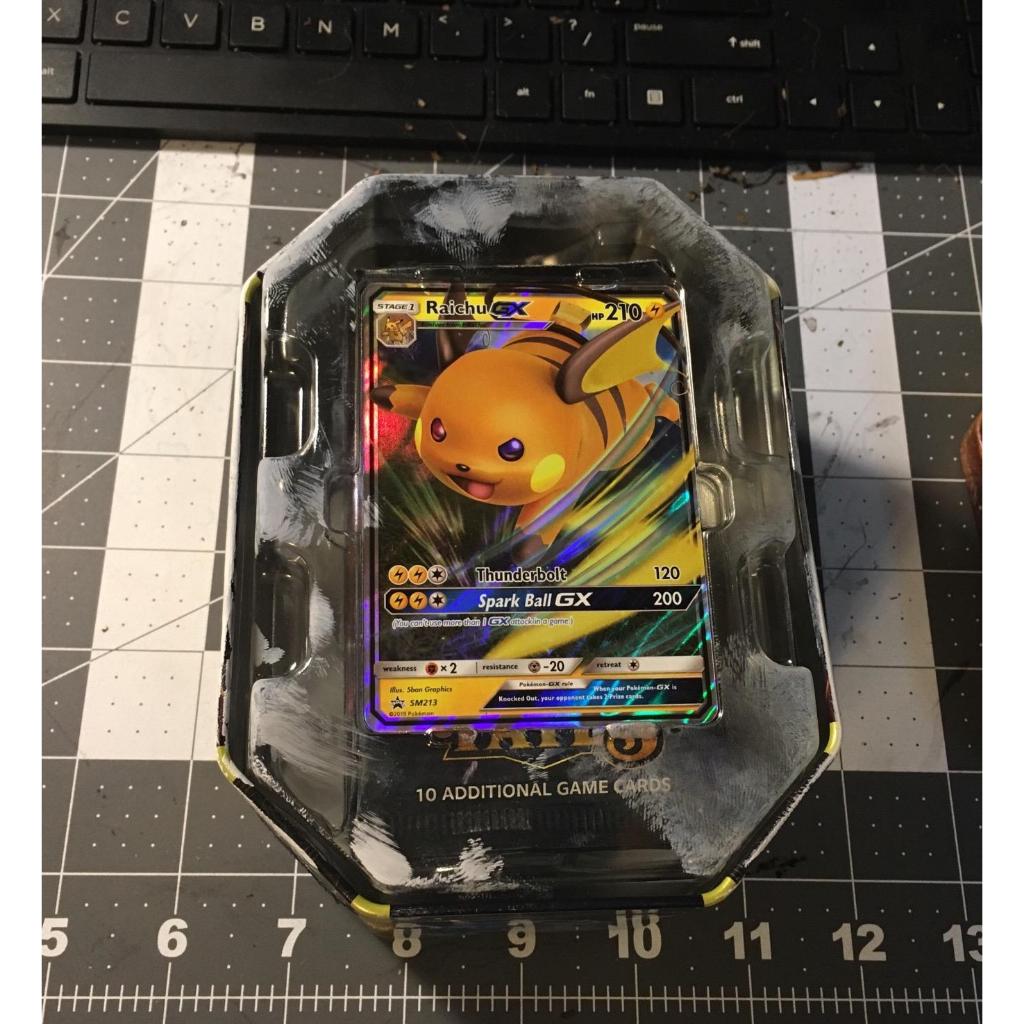 Pokemon TCG: SM11.5 Hidden Fates Gx Tin- Raichu + 1 of 3 Foil Pokémon-GX Cards + 4 Booster Pack