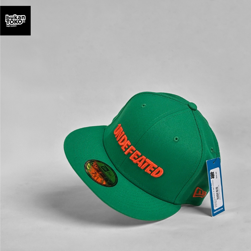 Topi New Era x Undefeated