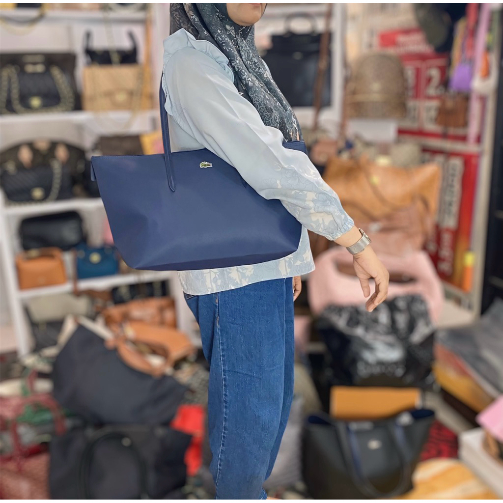 preloved tas biru zipper lacoste
