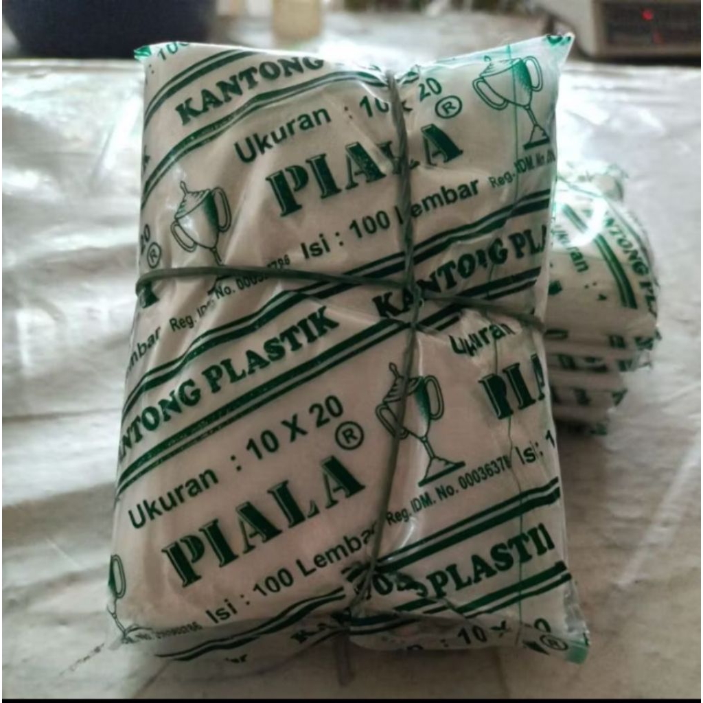 Plastic 10x20 dollar dan piala 1 bal ( 100 pak )