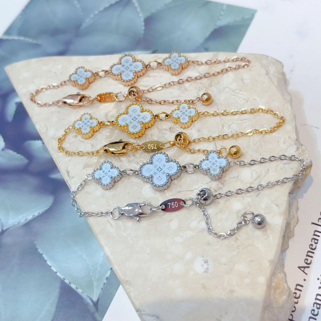 Gelang serut bunga biru embos 750 Titanium