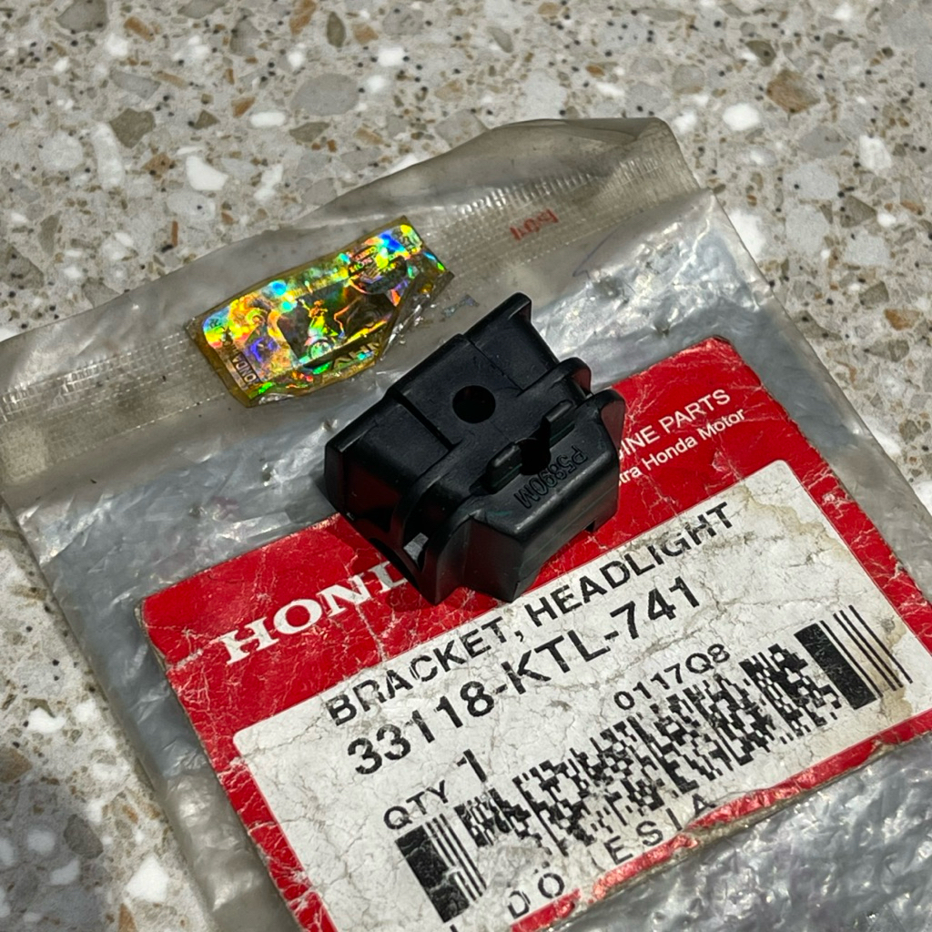 BRACKET BRAKET DUDUKAN LAMPU DEPAN SUPRA FIT NEW ORIGINAL AHM 33118 KTL 741