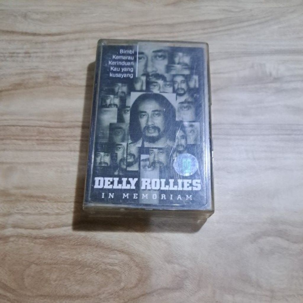Kaset Musik Delly Rollies In Memoriam Hitam Putih Cover Potongan Wajah