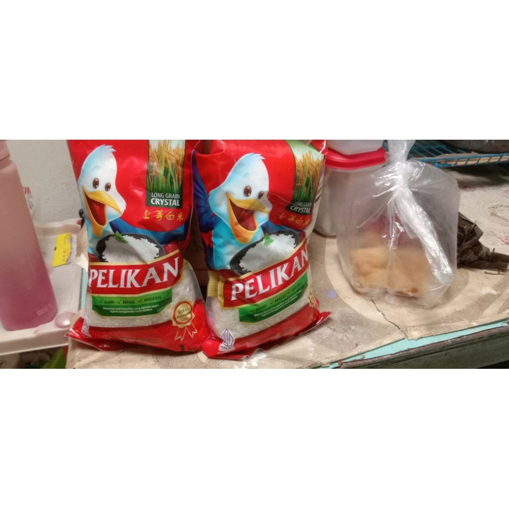

beras pelikan kemasan 1kg an