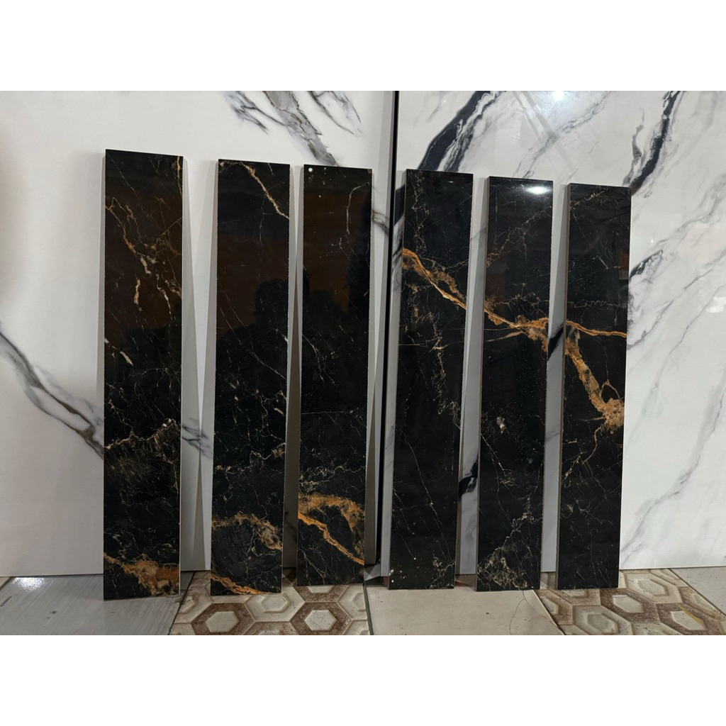 plin granit 10x60 hitam corak marmer emas