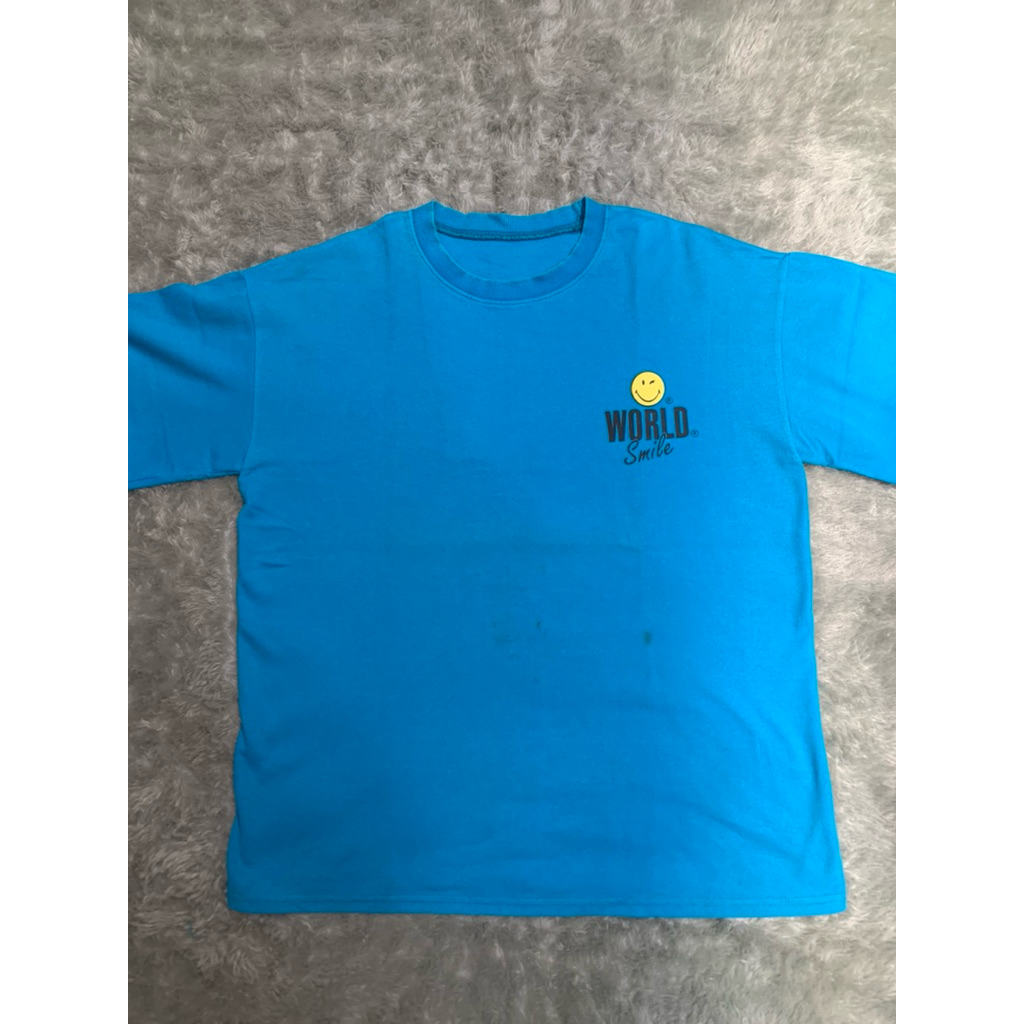 baju world smile oversize preloved