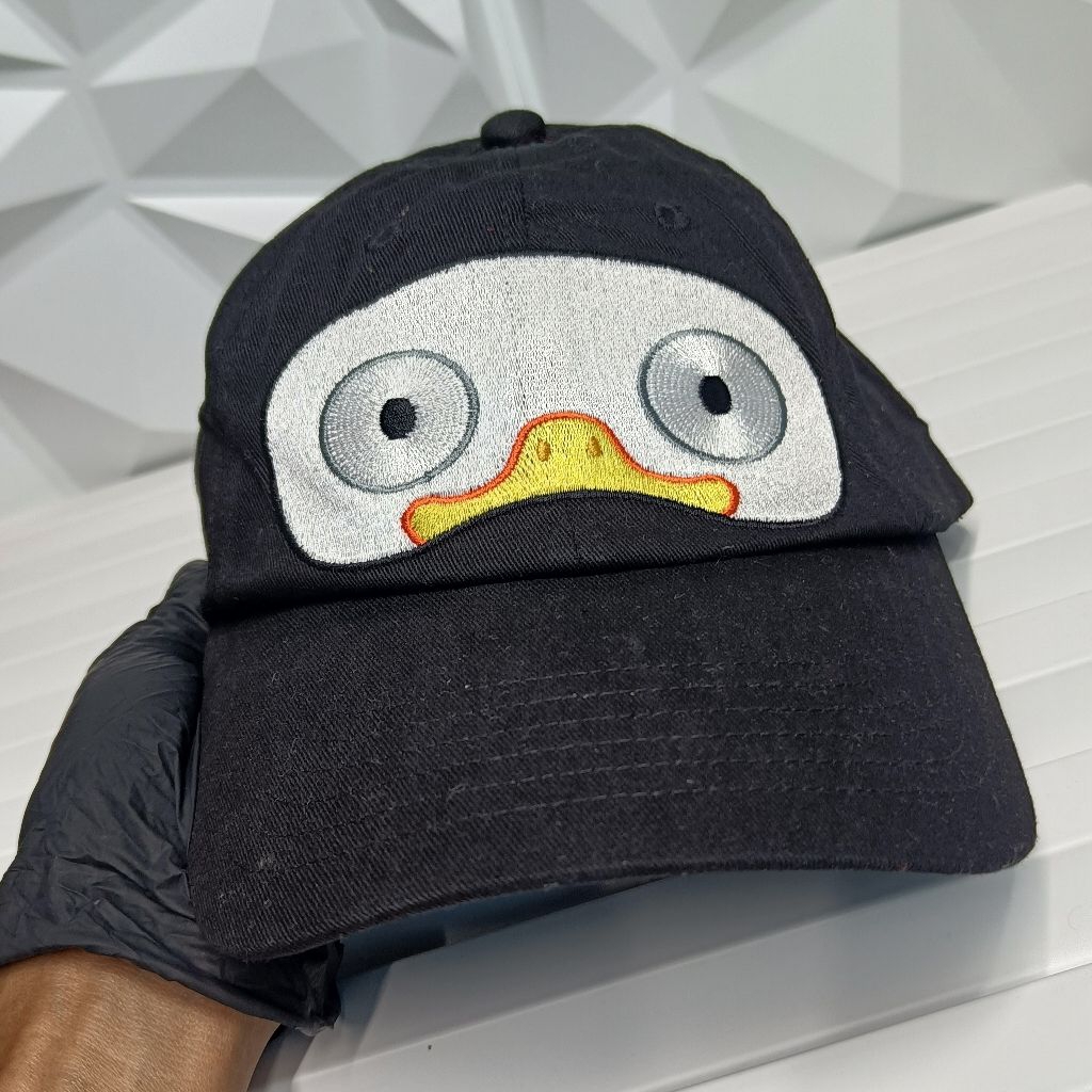 Topi Pinguin Madagascar