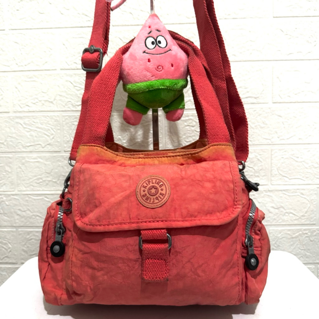 tas sling bag kipling. tas selempang kipling nilon. tas prelop. orange