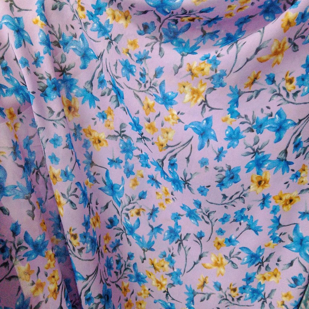 Kain Ceruty Baby Doll Motif Bunga Biru Kuning Dasar Ungu Lilac Meteran Bahan Khimar Syari (Harga Kai