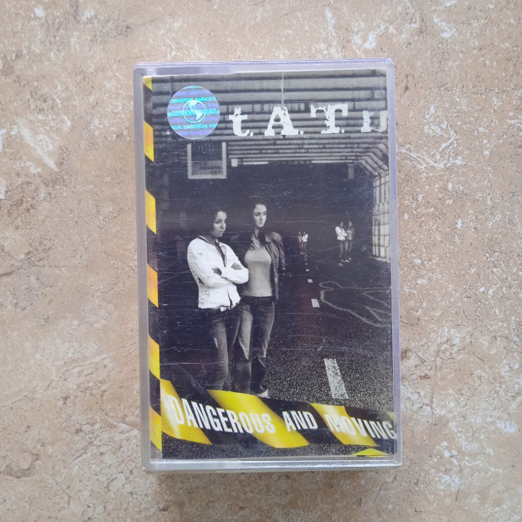 Kaset Pita Tatu "Dangerous And Moving"