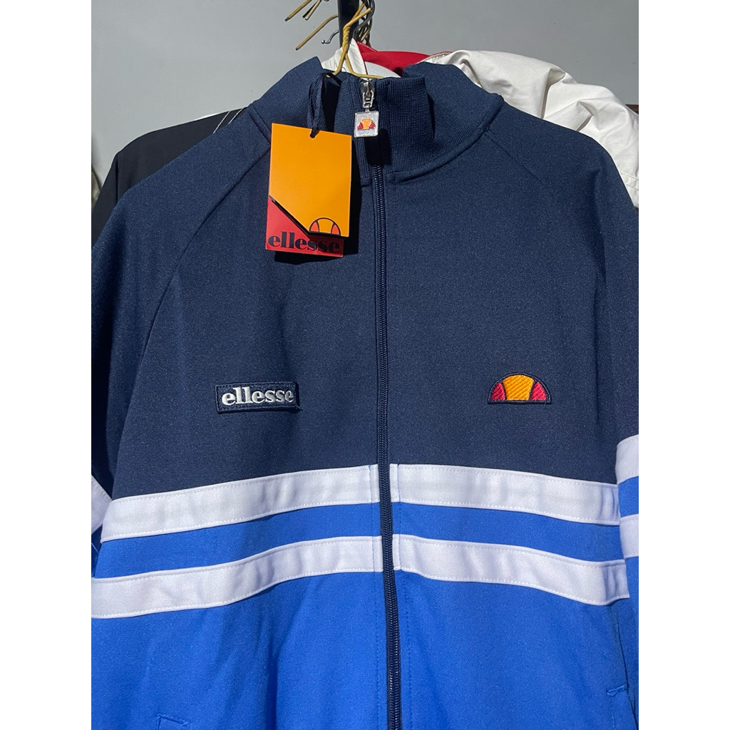 Tracktop Ellesse Remini the firm