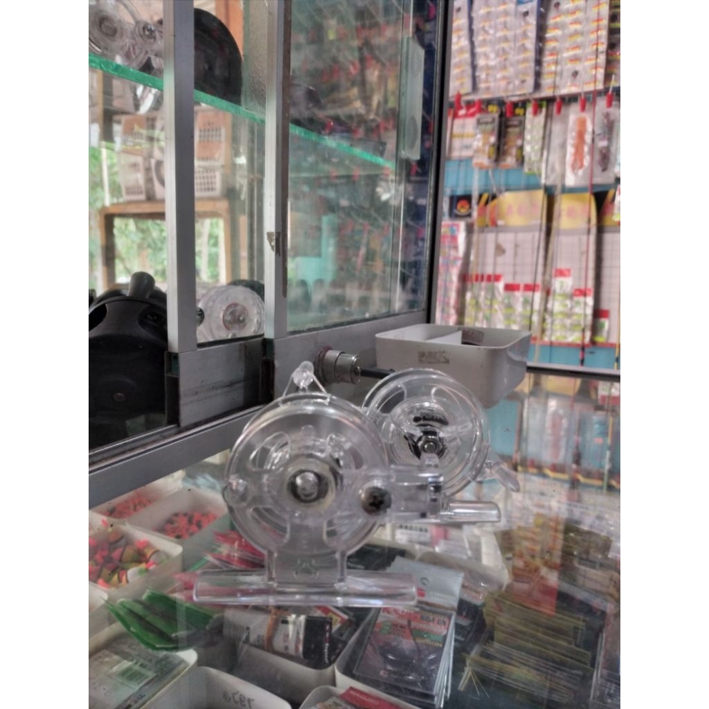 Reel Pancing Tokos Ogawa D45 - Bening-FX 45 Desain Ergonomis, Material Plastik ABS, Handle Fleksibel