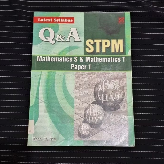 Buku Q&A STPM Mathematics S & Mathematics T Paper 1" textbook by Khoo Ee Sin, designed for the lates