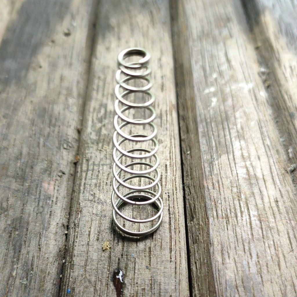 Per spring kerucut bahan stainless.