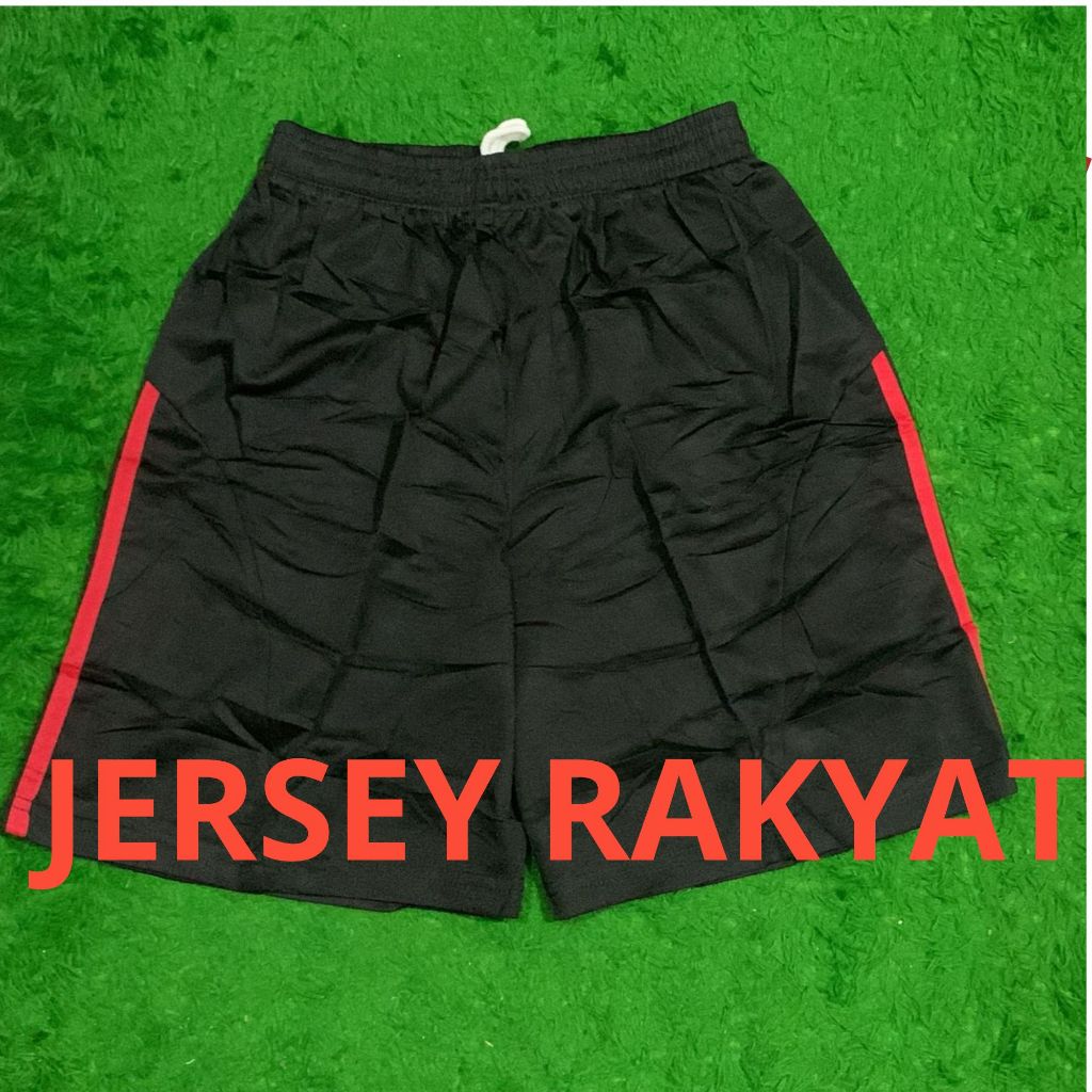 celana pendek bola hitam merah 2025 2026
