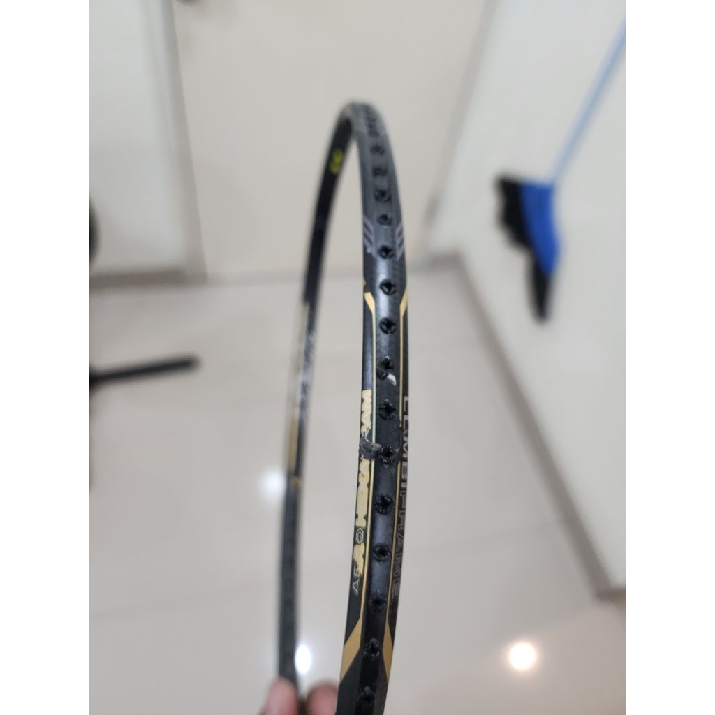 raket mizuno second minus retak