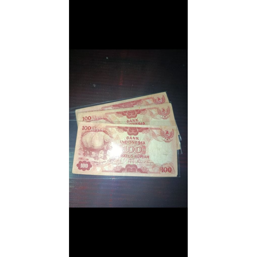 uang kertas kuno 100 badak kondisi bekas edar