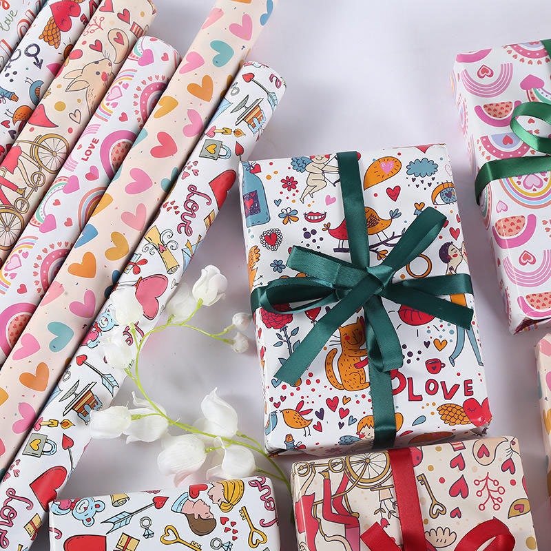 TGA Kertas Kado 64.5x49cm Motif RANDOM Doraemon Winnie The Pooh Hello Kitty Avengers Garfield Melody