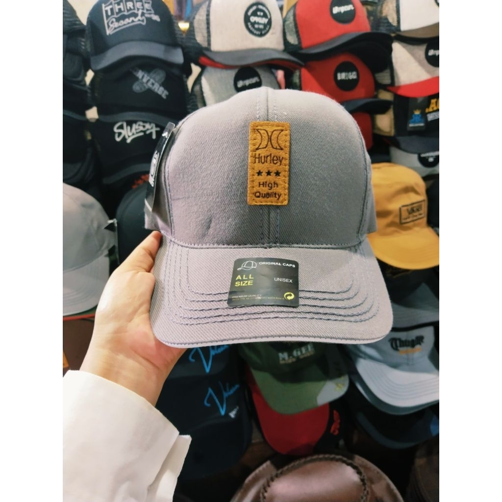 Topi Merk Tunas Warna abu bordir tempel