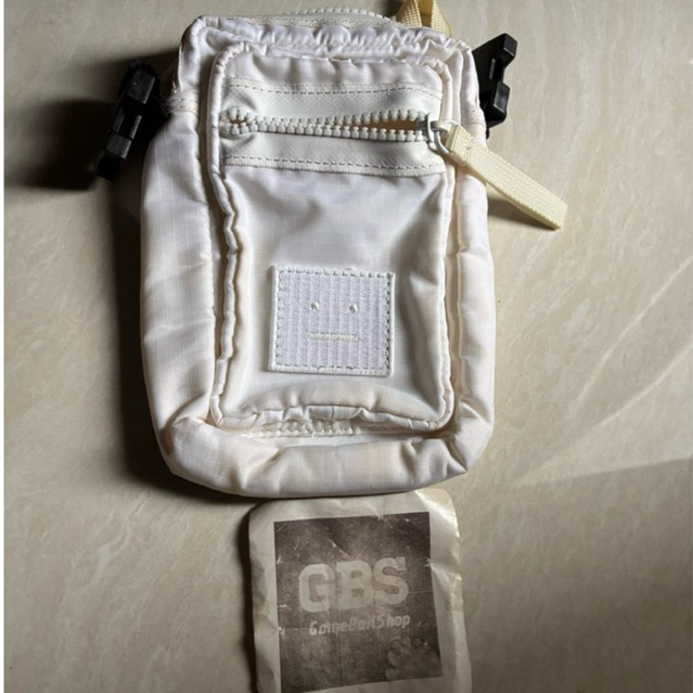 Acne Studios Arvel logo-appliquéd ripstop messenger bag in white