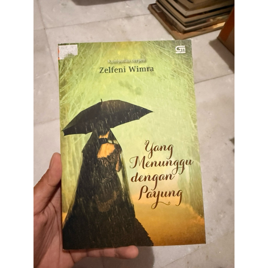 Yang Menunggu dengan Payung