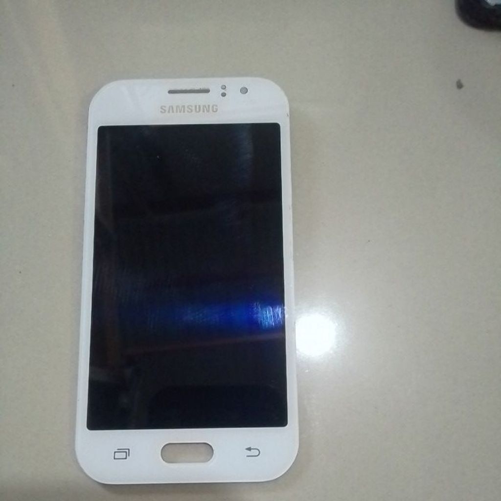Lcd samsung J1 ace ori copotan