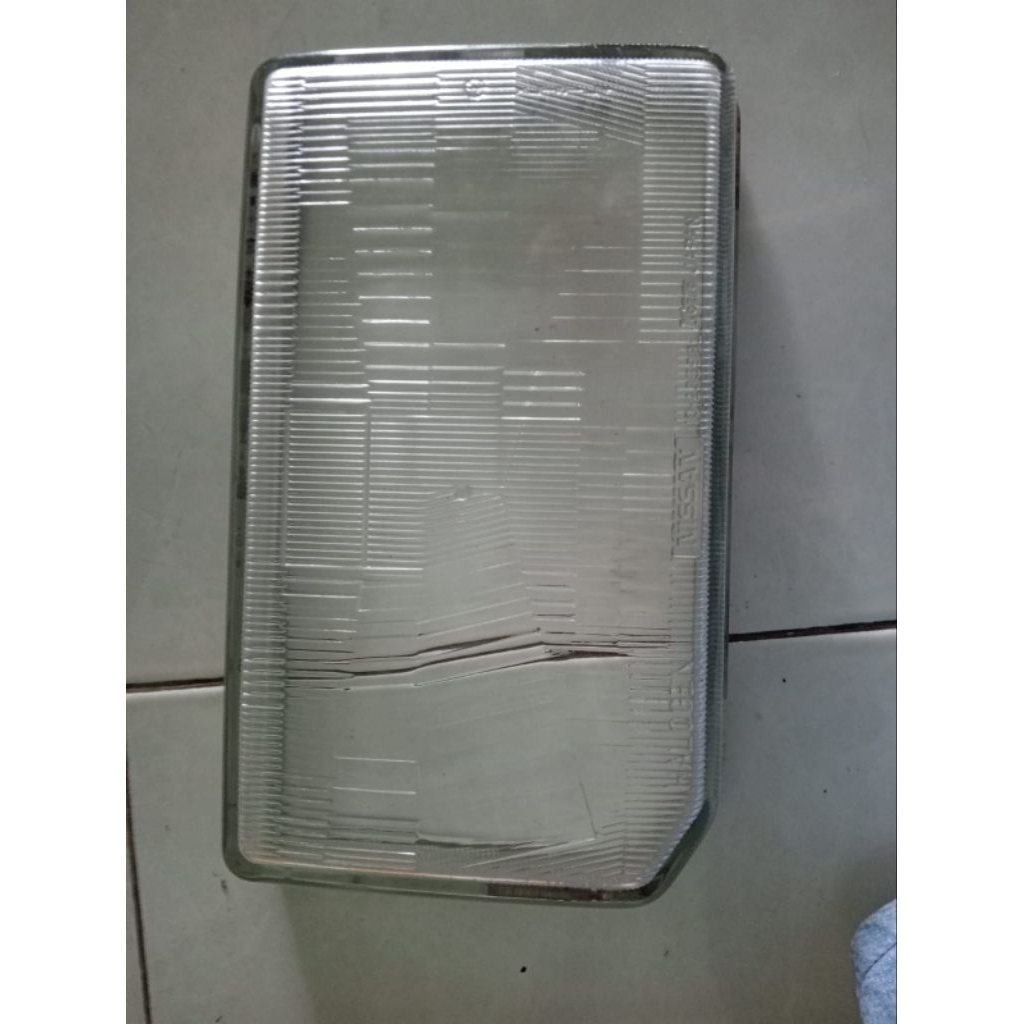 kaca lampu depan Nissan Terrano sebelah kiri th 97-2001 asli Nissan