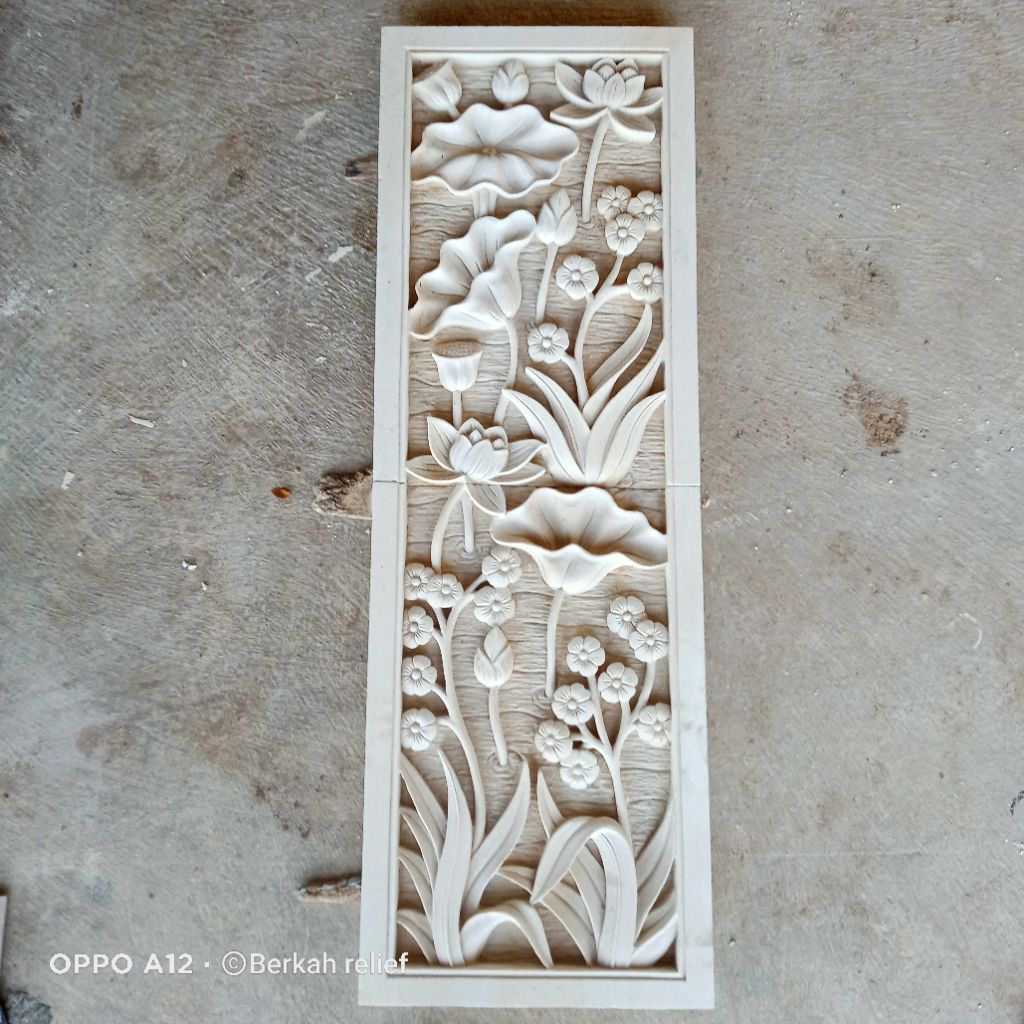 relief ukir batu alam motif bunga