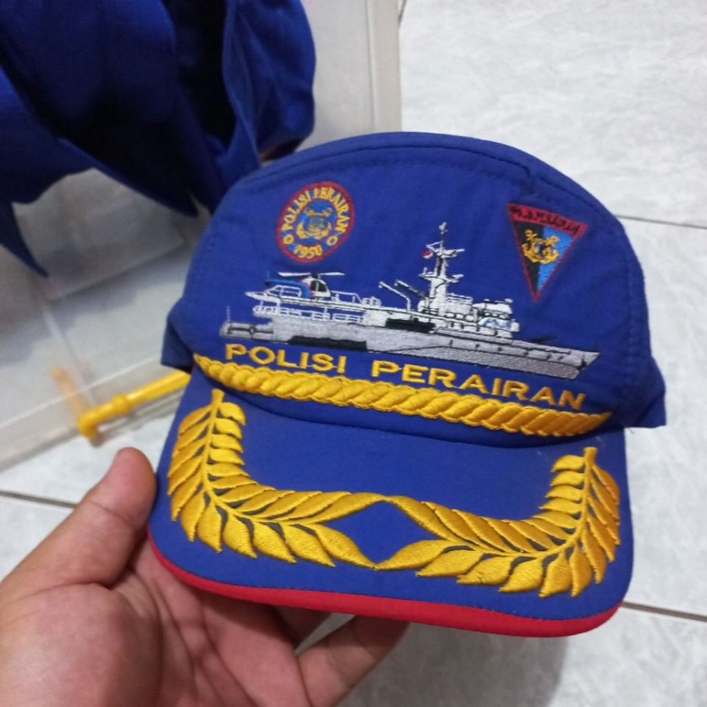 topi biru pamen airud polair